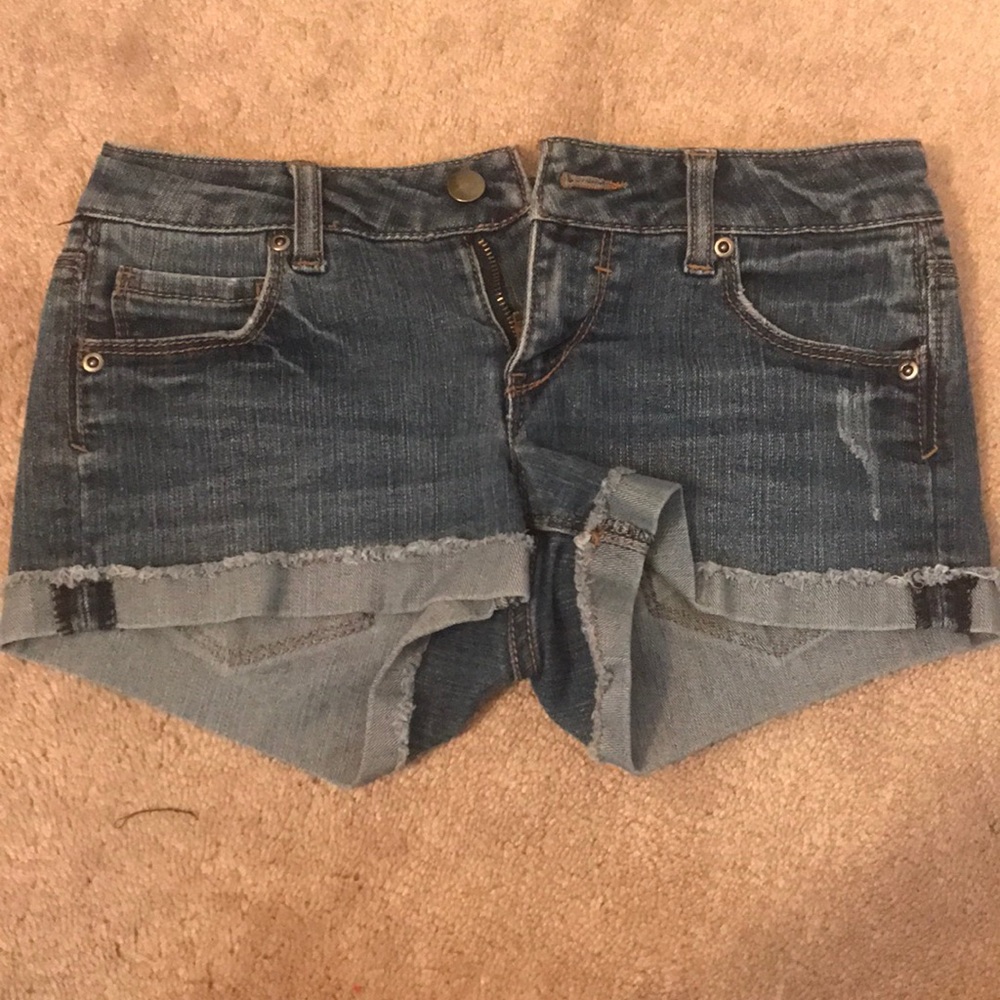Medium wash denim shorts with permanent cuff